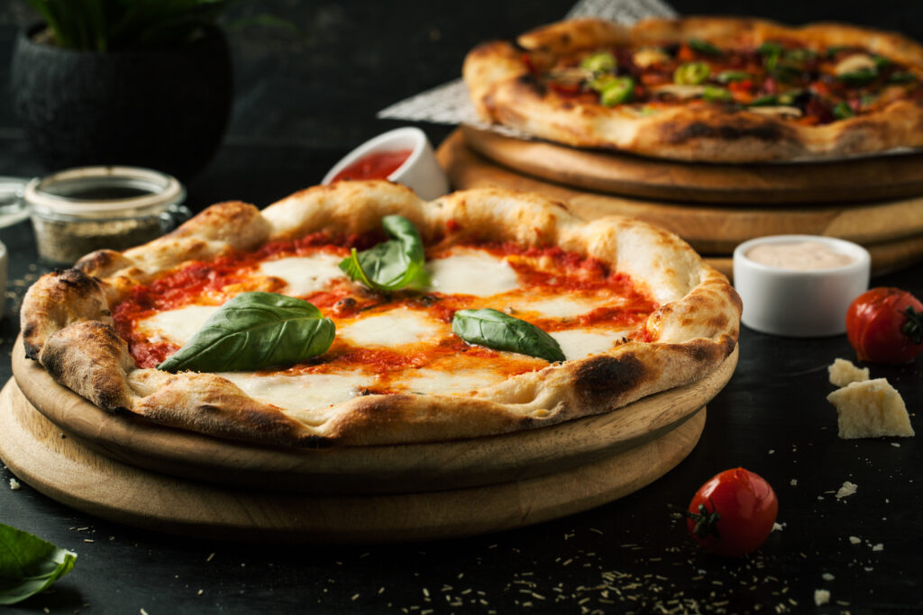 Delicious Margherita pizza with fresh sauce, mozzarella and basil