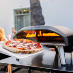 The Ooni Koda 12 pizza oven with pepperoni pizza