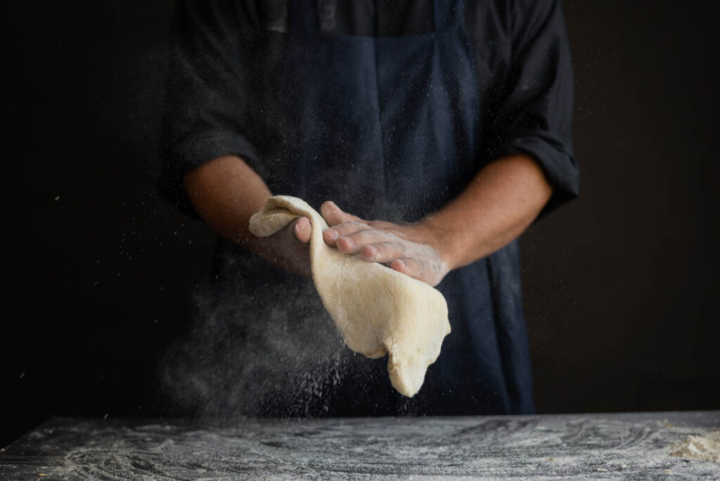 Chef making a hand tossed pizza, no pan necessary