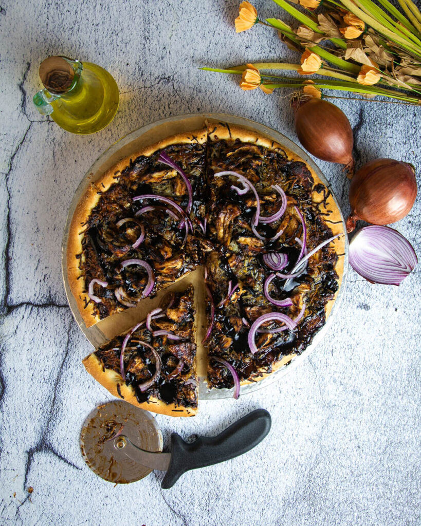 Top view of BBQ chicken pizza on a white background