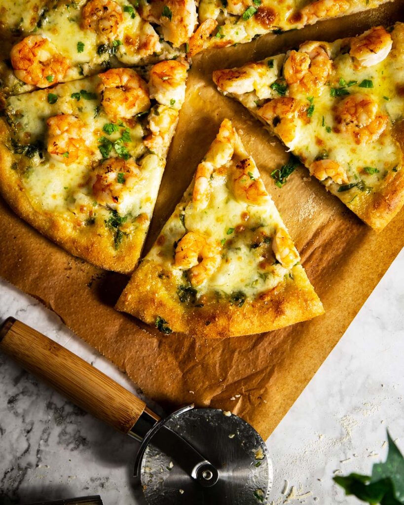 sliced garlic parmesan shrimp pizza ready to eat